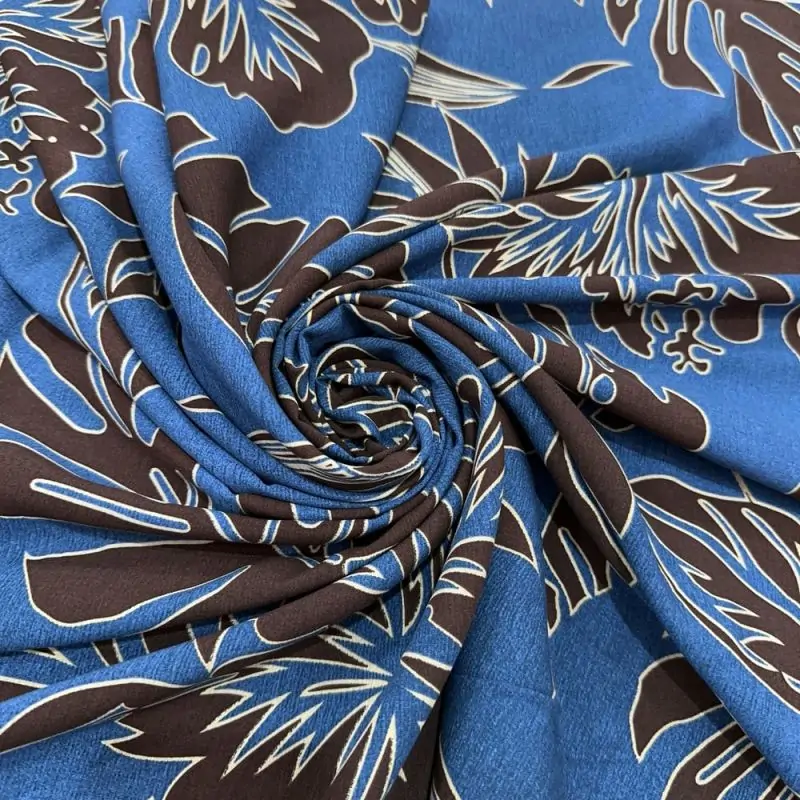 Tecido Viscose Estampada Folhagens Preto e Fundo Azul • Luema Tecidos